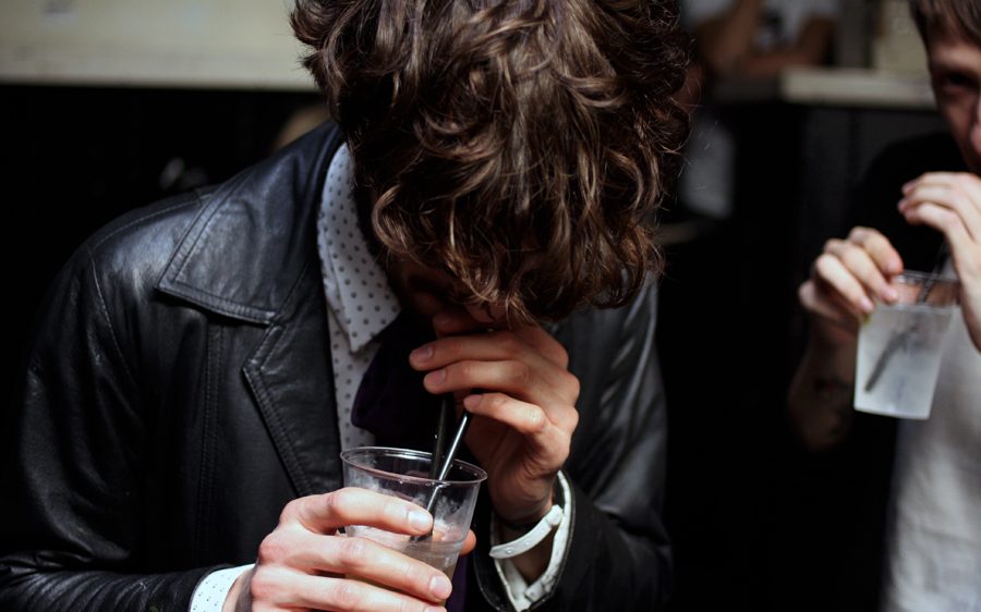 man drinking alcohol