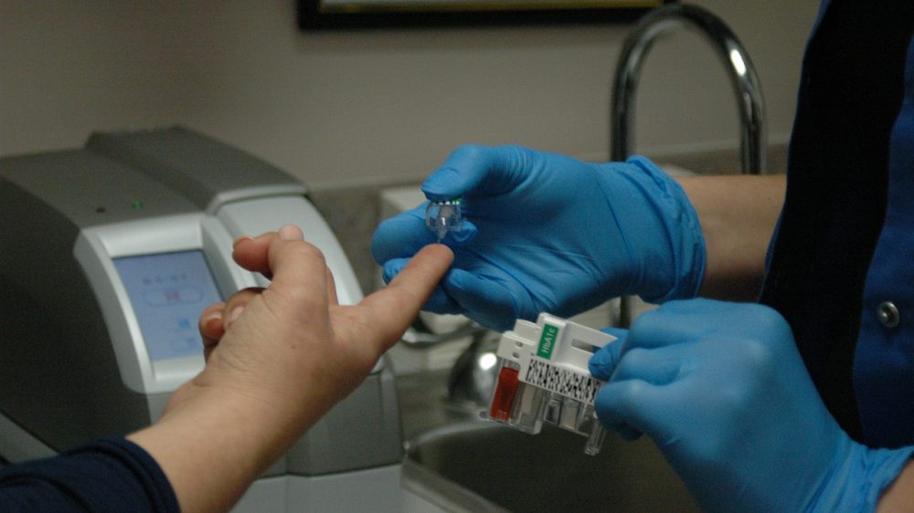 Nurse giving diabetes test